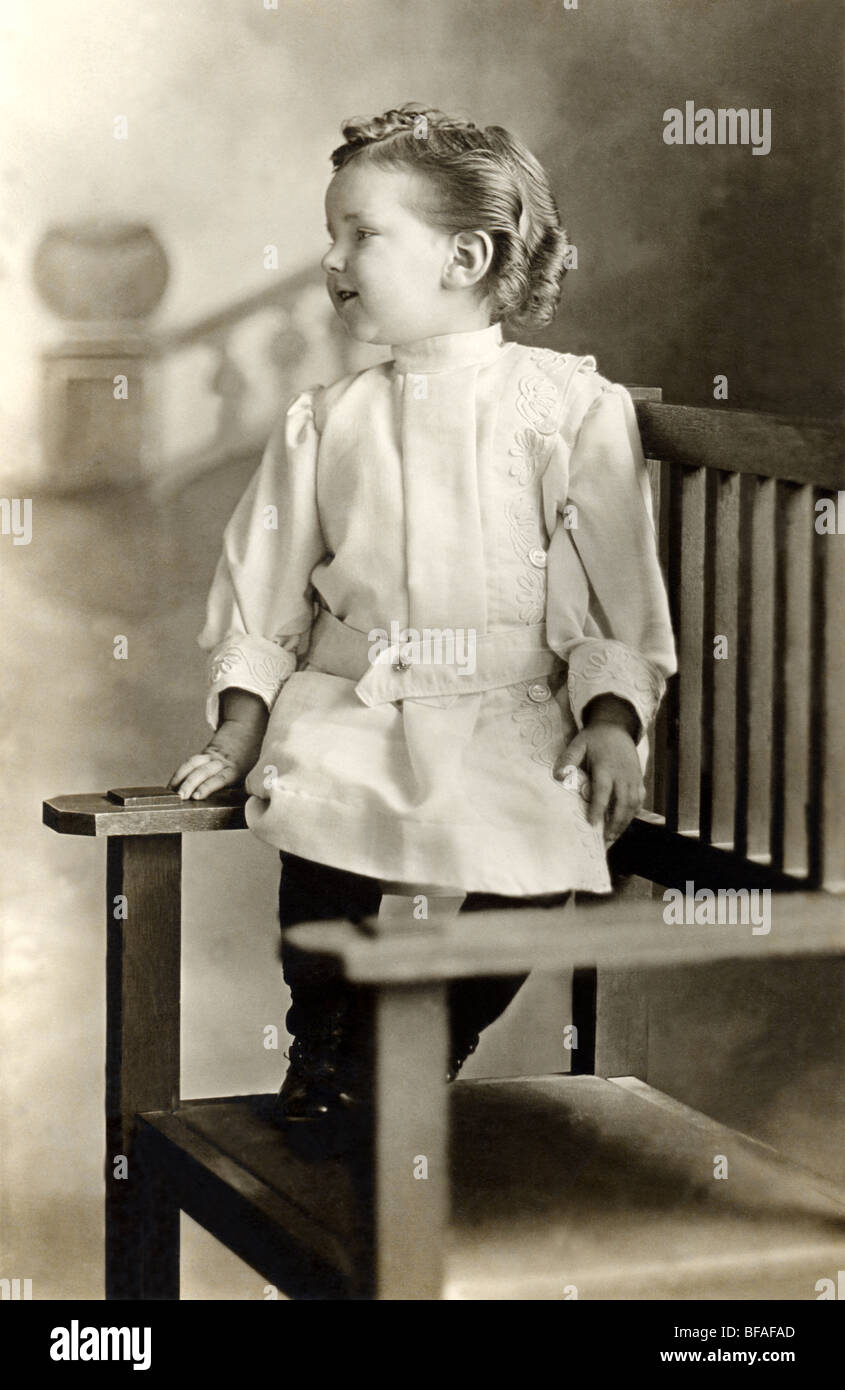 Vain Little Boy Showing Off Elaborate Hairstyle Stock Photo