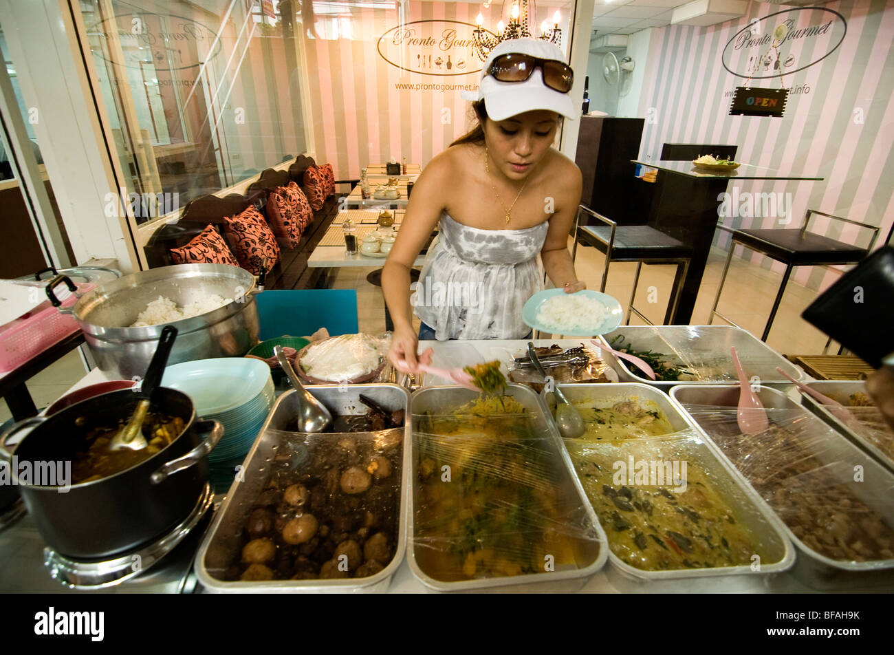 Beautiful Thai food vender selling precook food and rice (Khao raad Keang), Bangkok, Thailand. Stock Photo