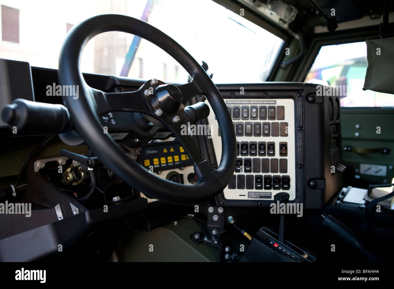 Detail of a military jeep inside steering wheel and army command