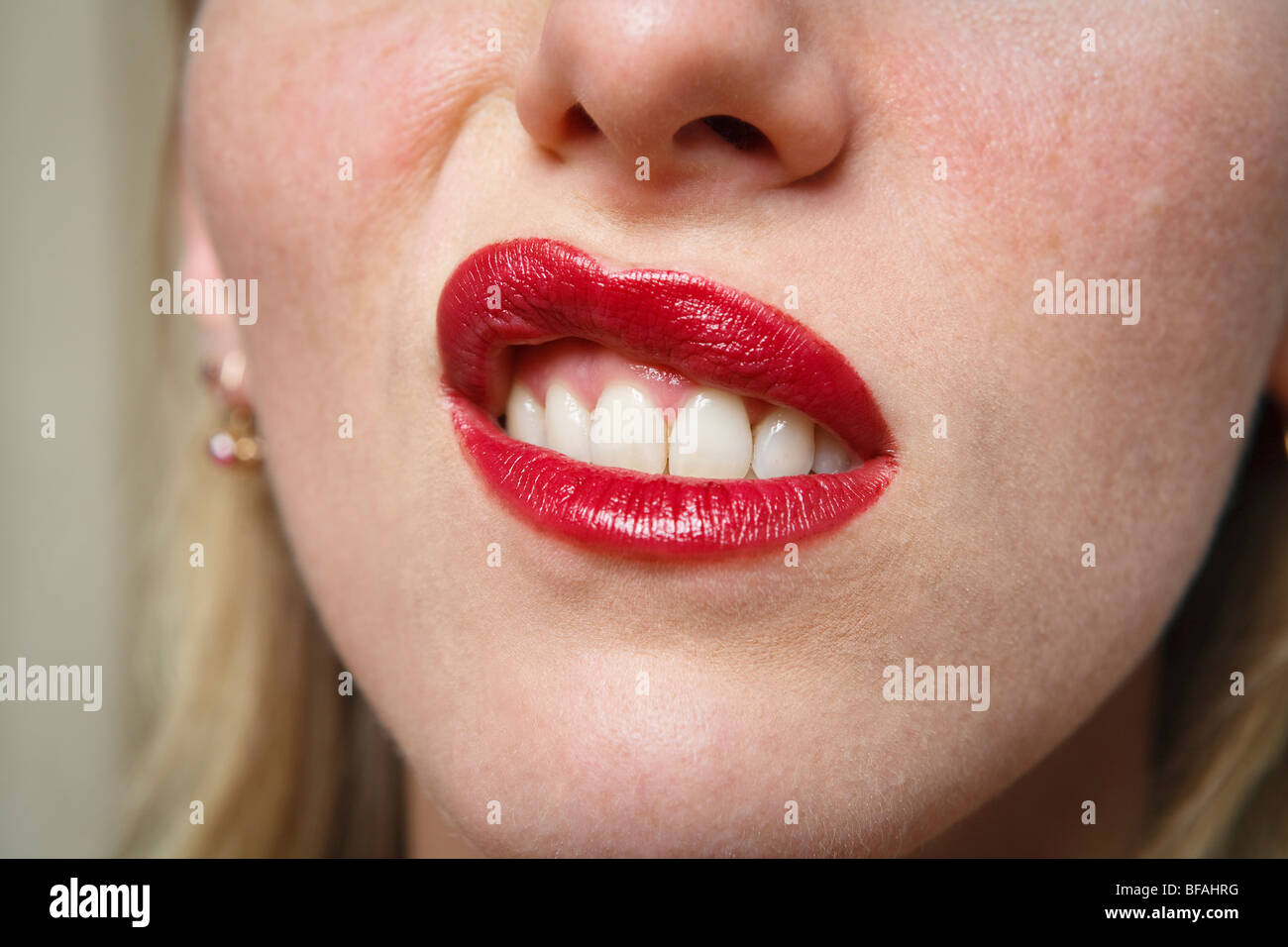 Young woman with a disdainful expression, lip turned up scornfully or skeptically Stock Photo