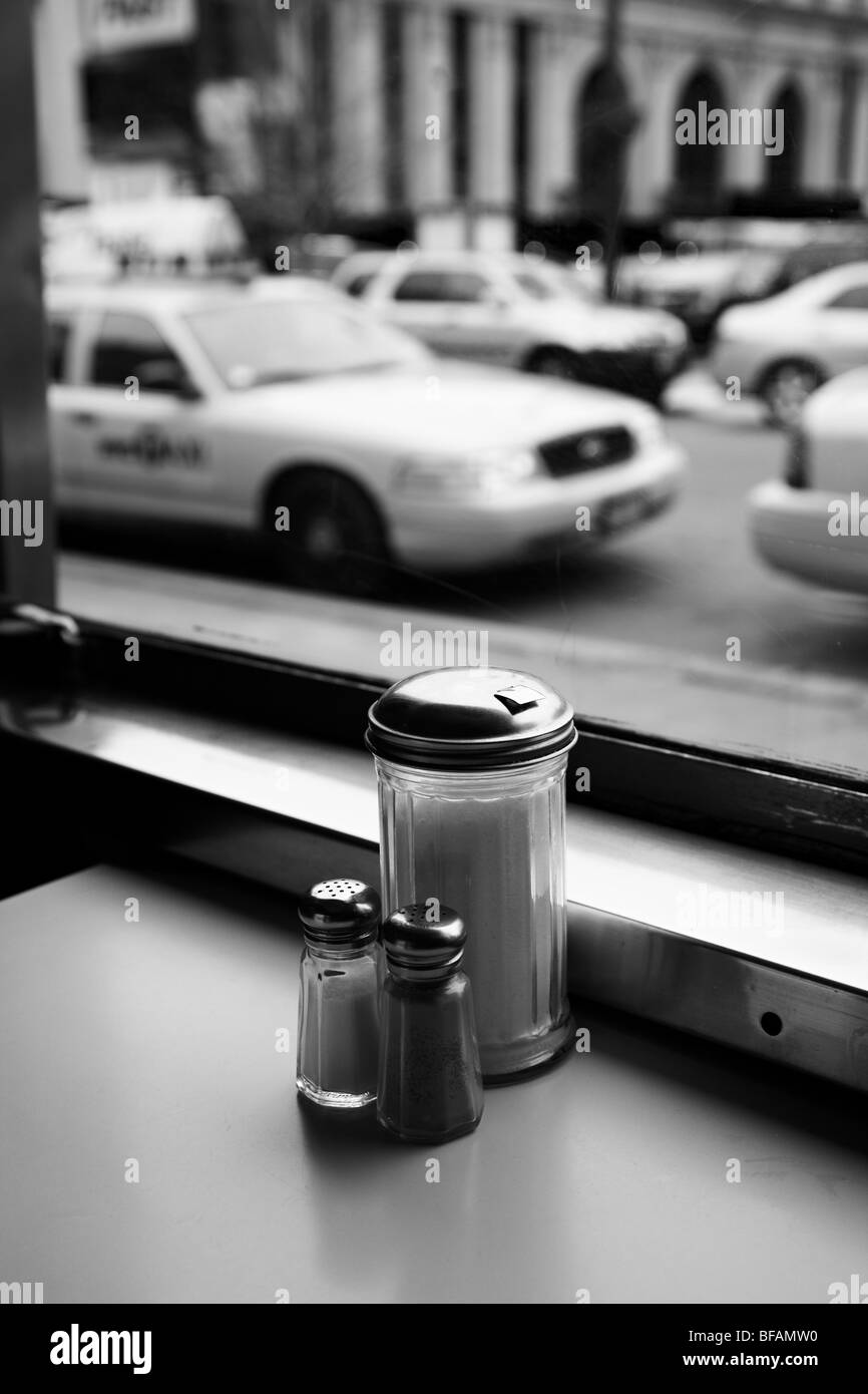 View out of a diner window with parked taxis outside. Stock Photo