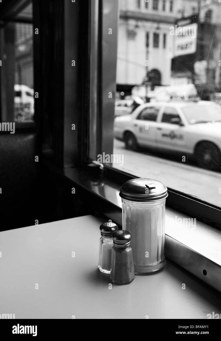 View out of a diner window with parked taxis outside. Stock Photo