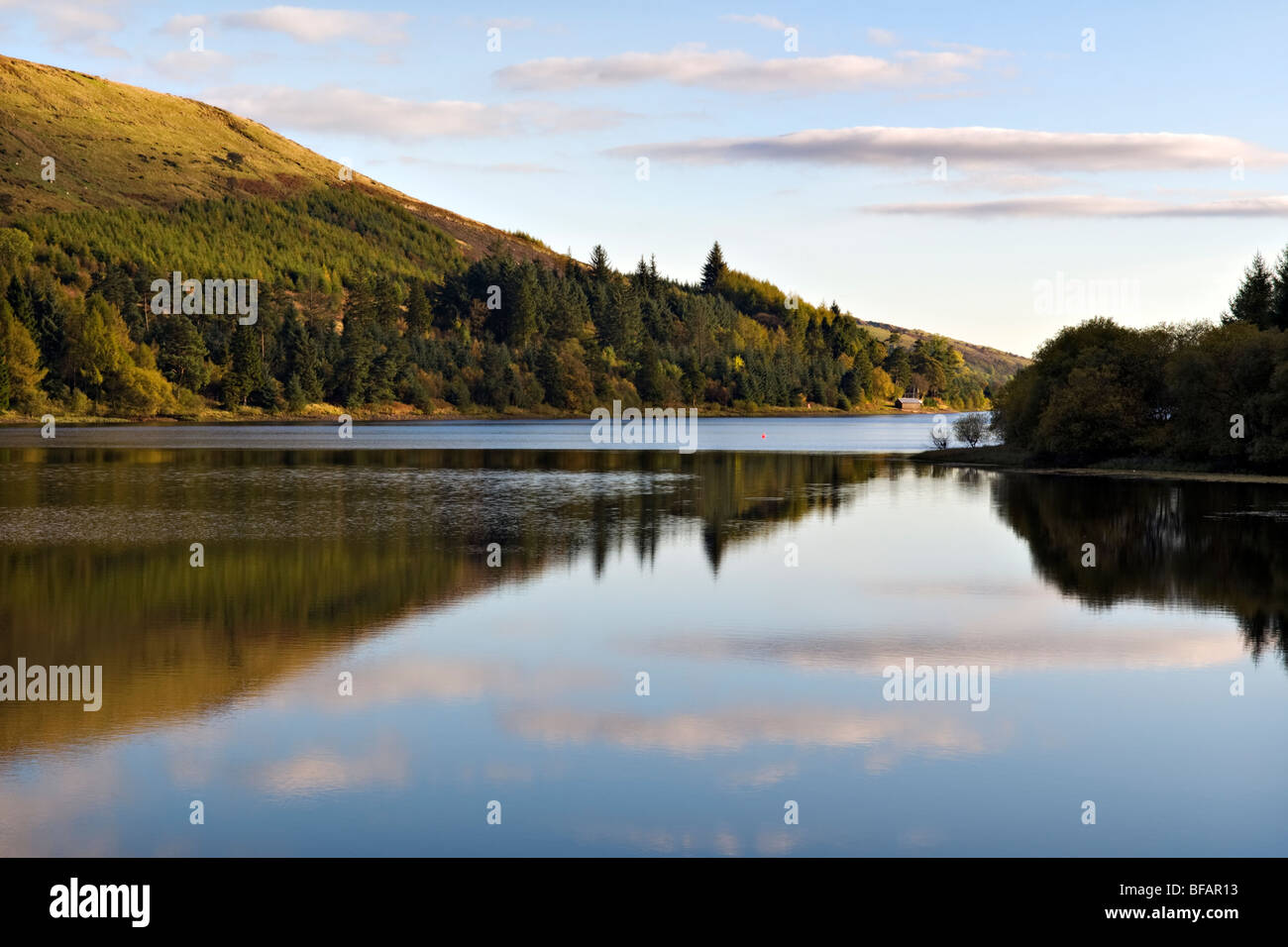 Pontsticill Reservoir (known locally as Dolygaer Lake) in the Brecon Beacons in Mid-Wales early evening with reflection Stock Photo