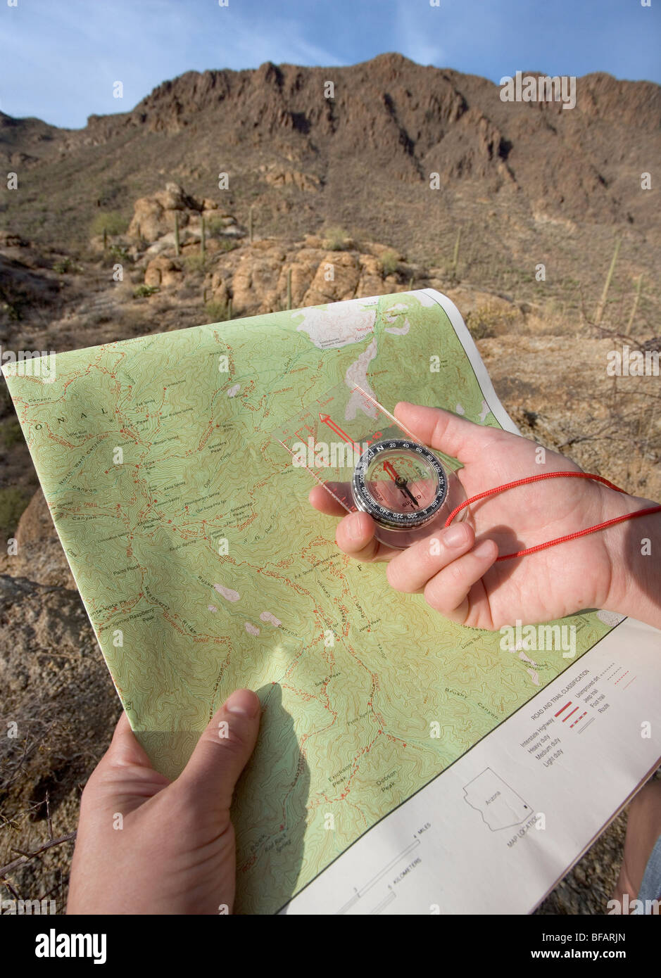 A hiking compass on a Topo map Stock Photo