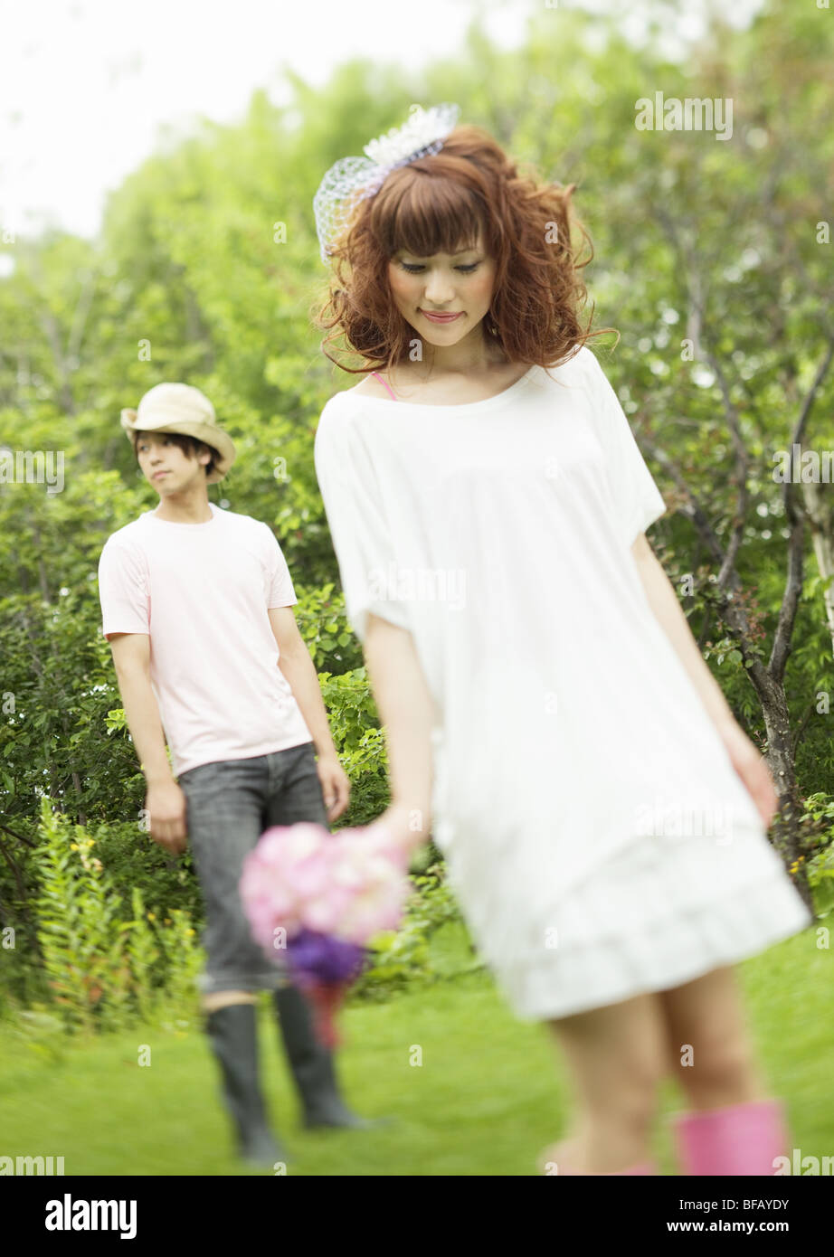 Young woman holding a bouquet Stock Photo - Alamy