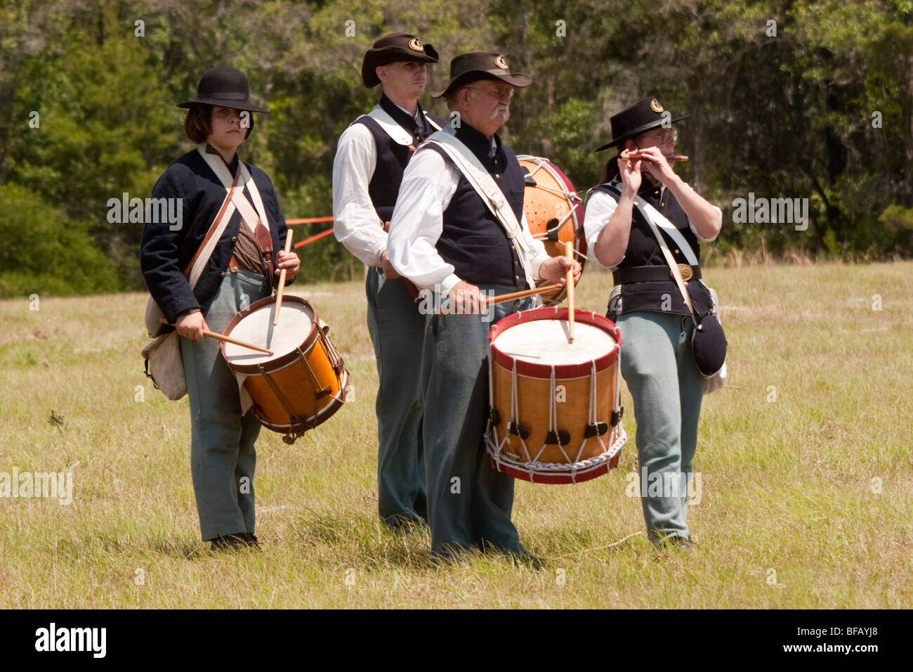 Civil war reenactors drum and fife corp playing in a field Stock Photo