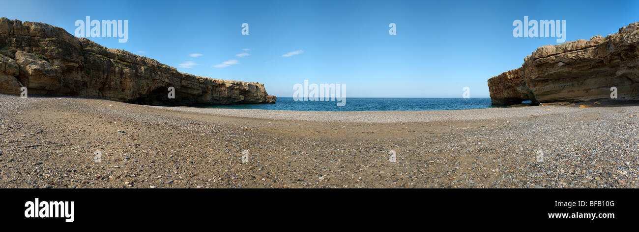 Panorama of deserted beach with limestone cliffs Crete Greece Stock Photo