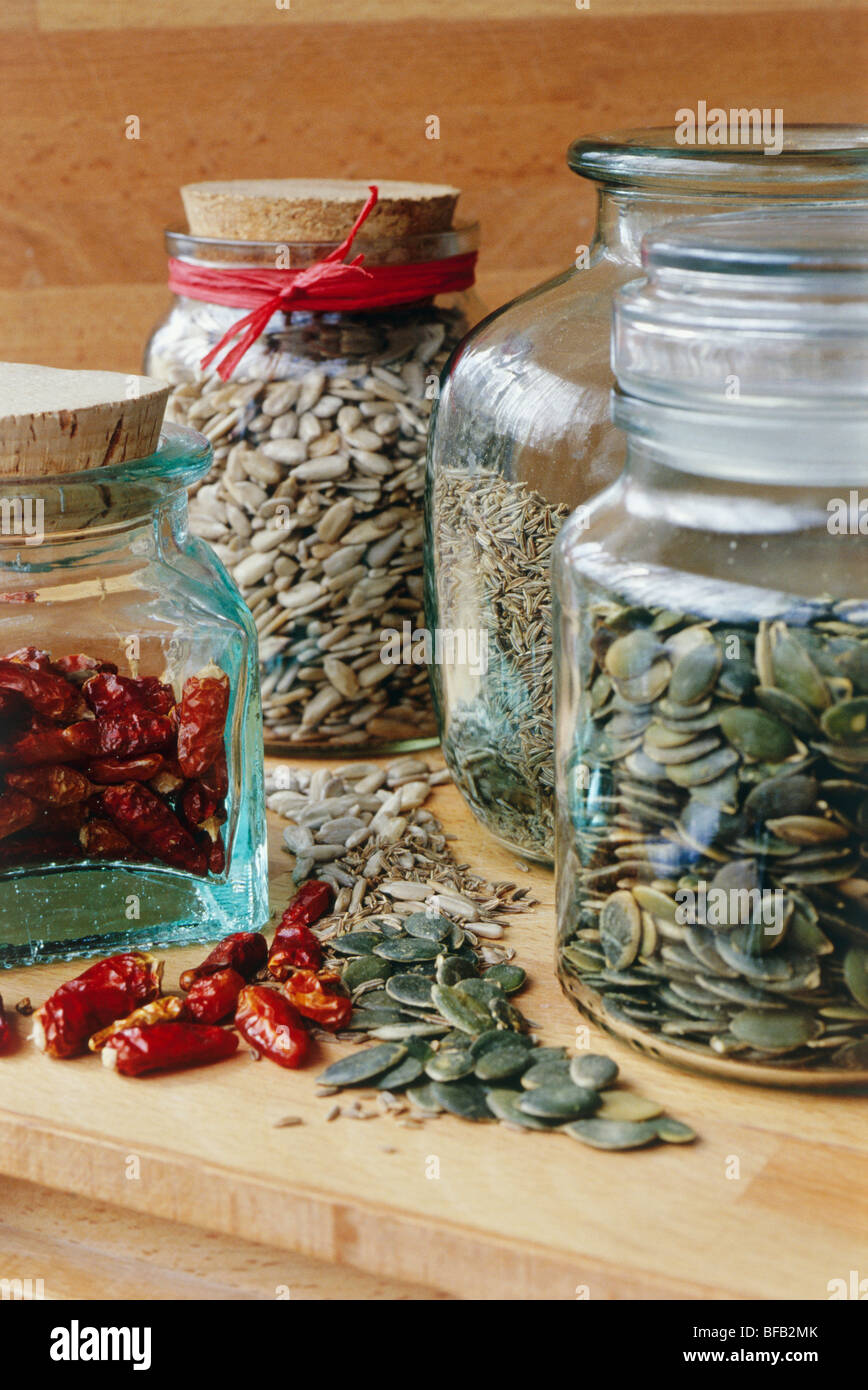 Food, Dried seeds in jars on shelf Stock Photo