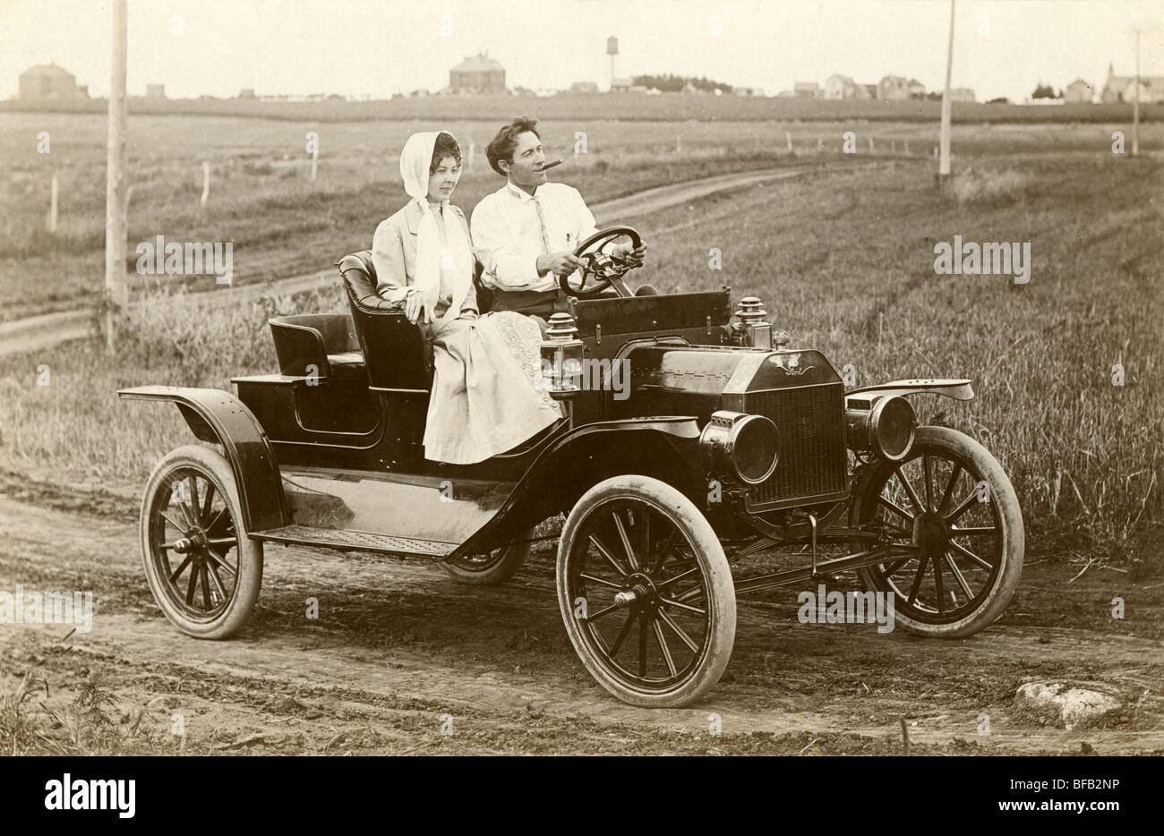 Attractive Couple Driving Model T Ford Stock Photo