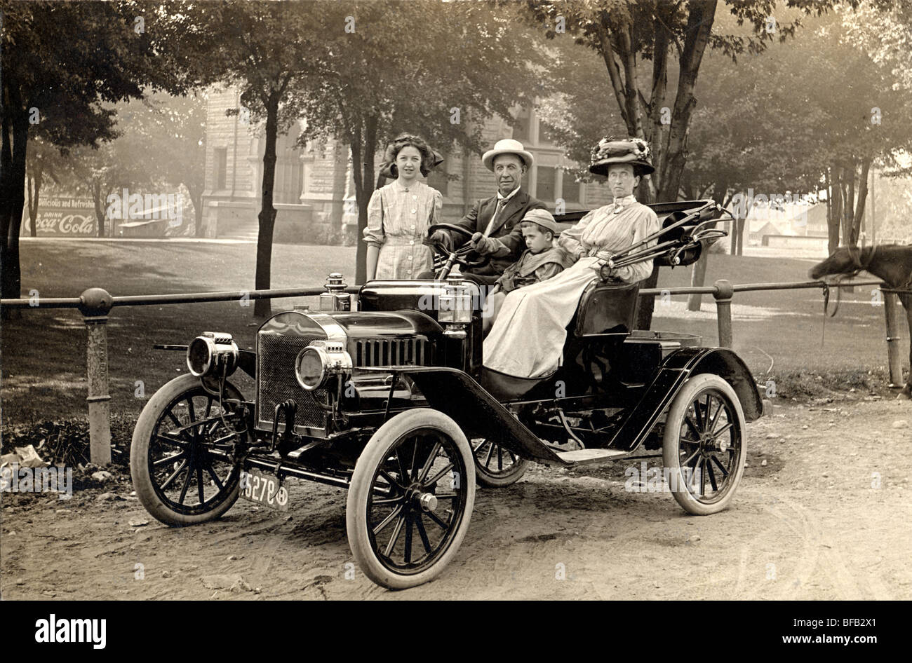 Family in New Compact Automobile Stock Photo
