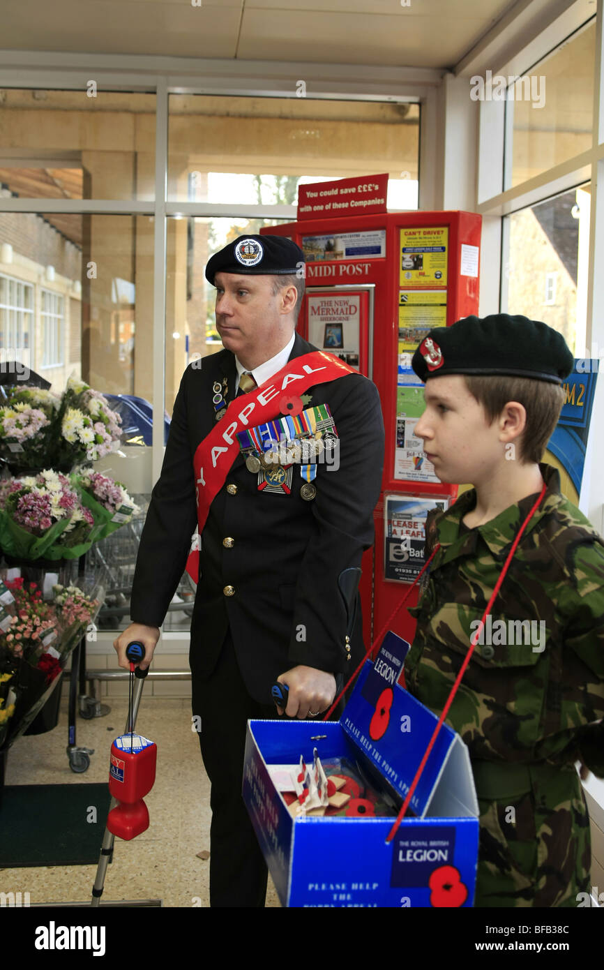 Ex-Serviceman and his son collecting money for the Royal British Legion Poppy Appeal Stock Photo