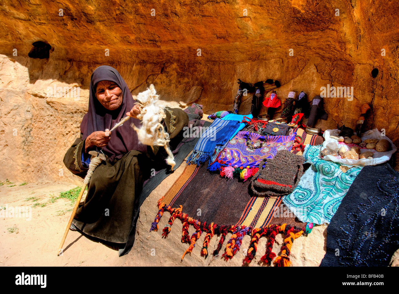 Local Bedouin lady selling trinkets, Al-Beidha, Little Petra, Jordan Stock Photo