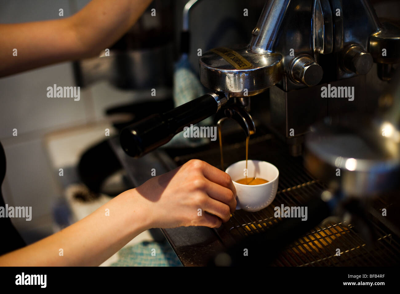 Cafe co-owner Ai makes an espresso at Cafe Ish in Surry Hills, Sydney, Australia Stock Photo