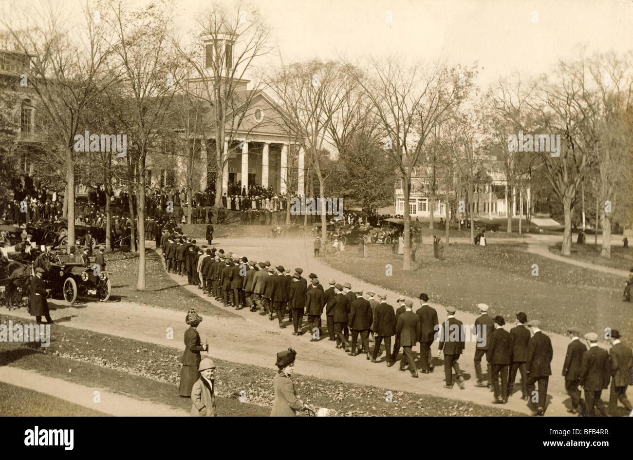 Men in College Graduation Procession Stock Photo