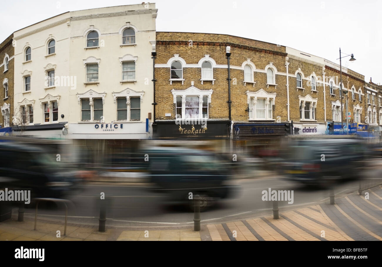winter street panorama in Wimbledon, London, with fast moving traffic Stock Photo