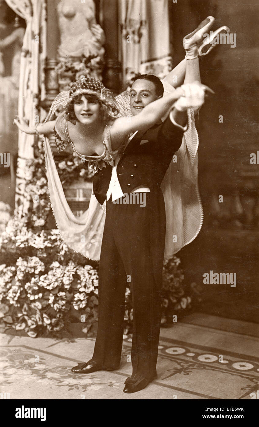 Dancing Couple with Man Holding Partner Aloft Stock Photo