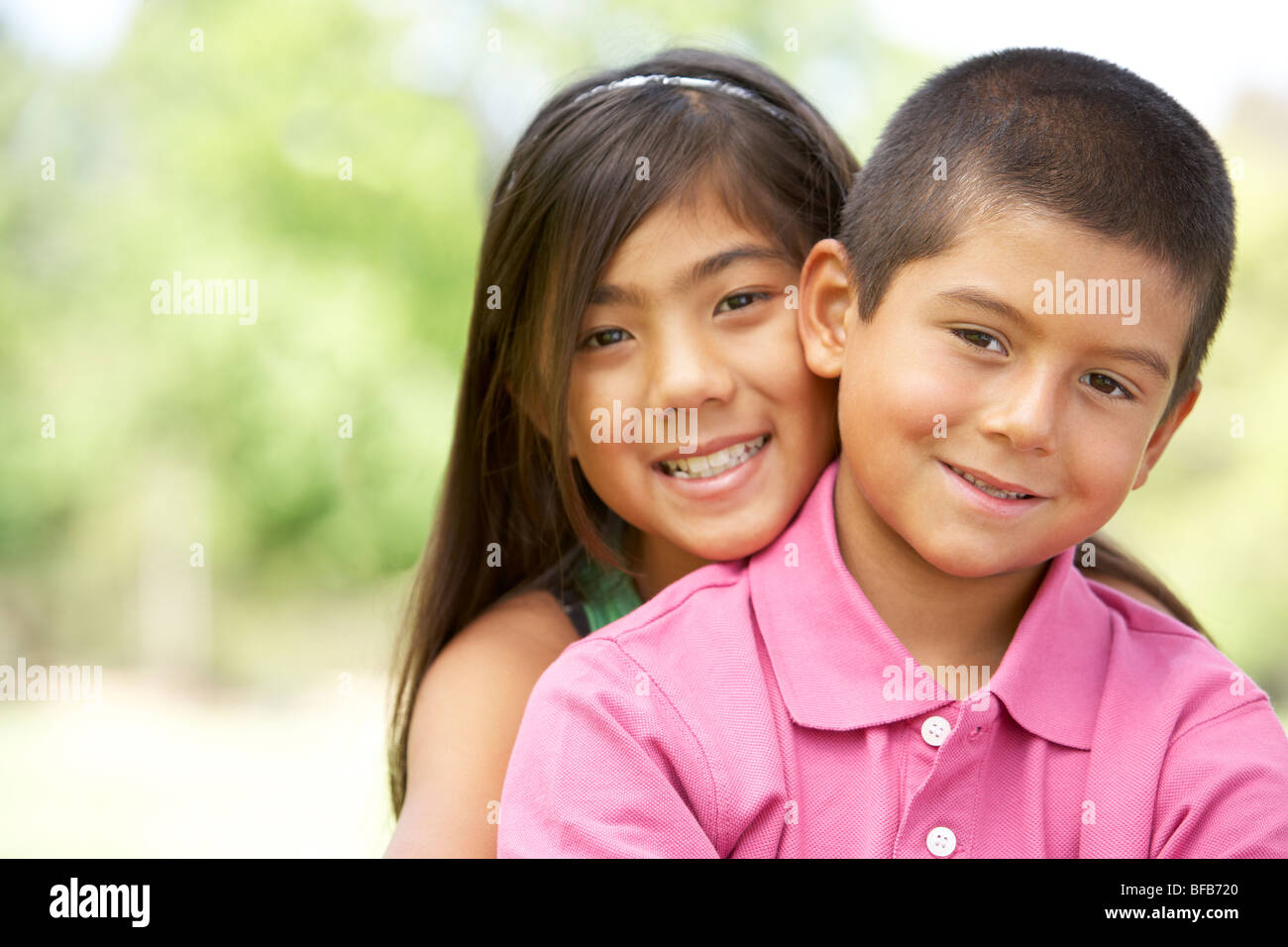 Portrait Of Brother And Sister In Park Stock Photo - Alamy