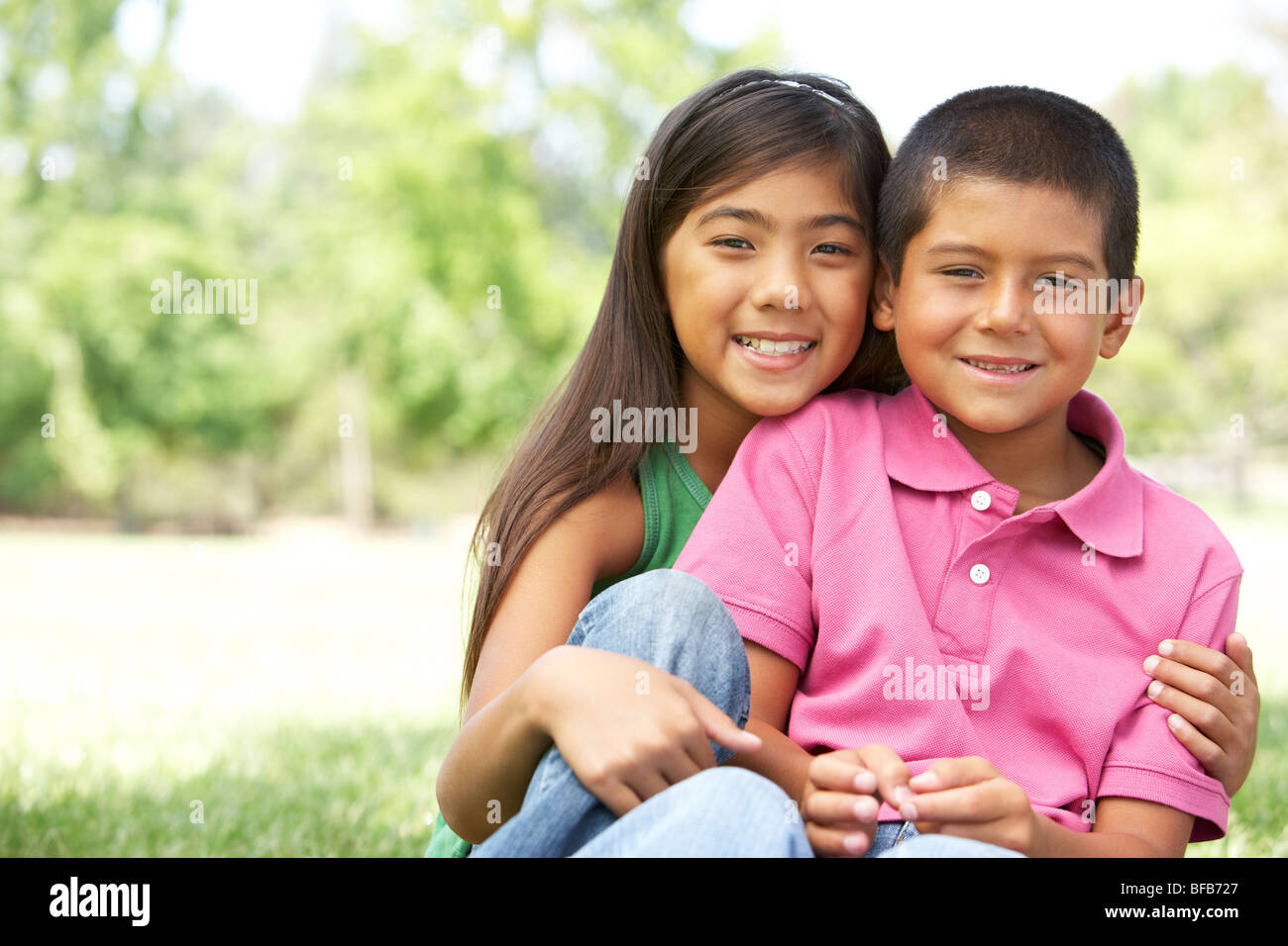 Portrait Of Brother And Sister In Park Stock Photo - Alamy
