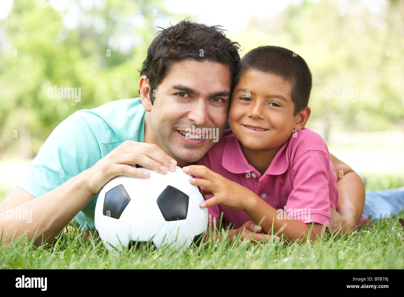 Father And Son In Park With Football Stock Photo - Alamy