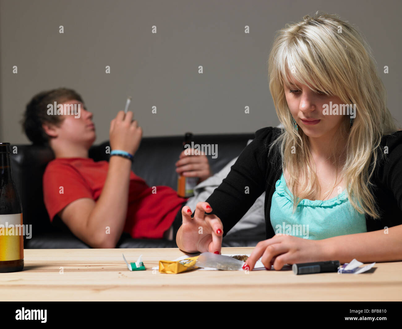 Teenage Couple Taking Drugs At Home Stock Photo