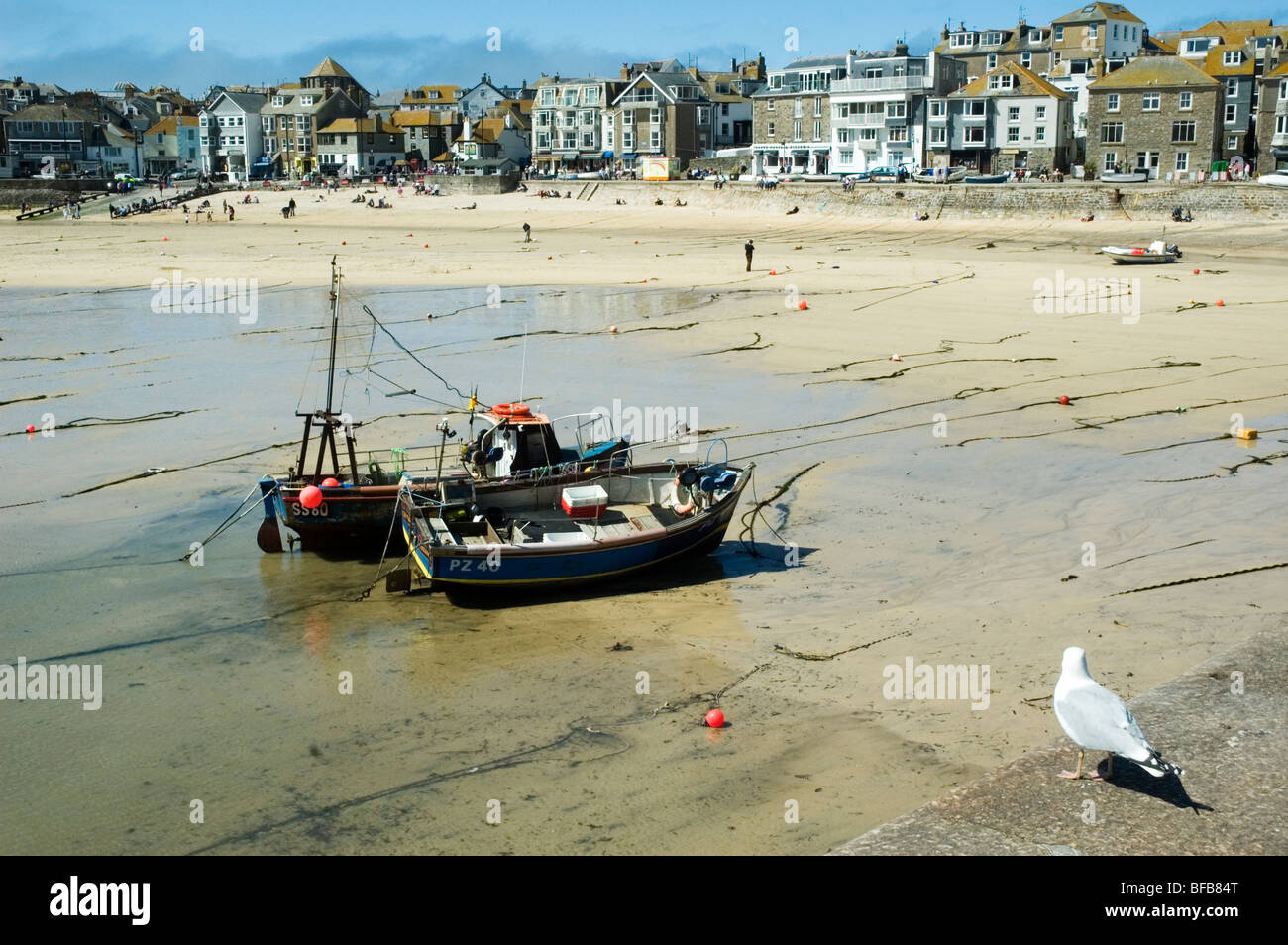 Fishing boats drawn up on the beach at St Ives, Cornwall, England Stock Photo