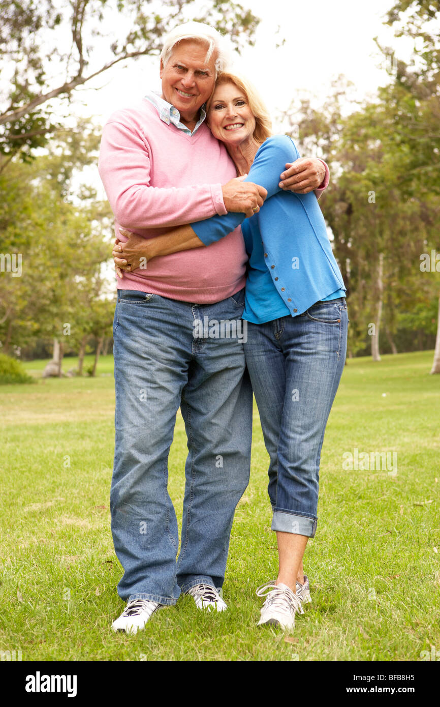 Senior Couple Walking In Park Stock Photo - Alamy