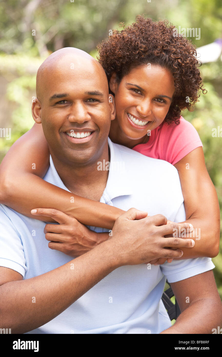 Young Couple Outdoors Hugging Stock Photo
