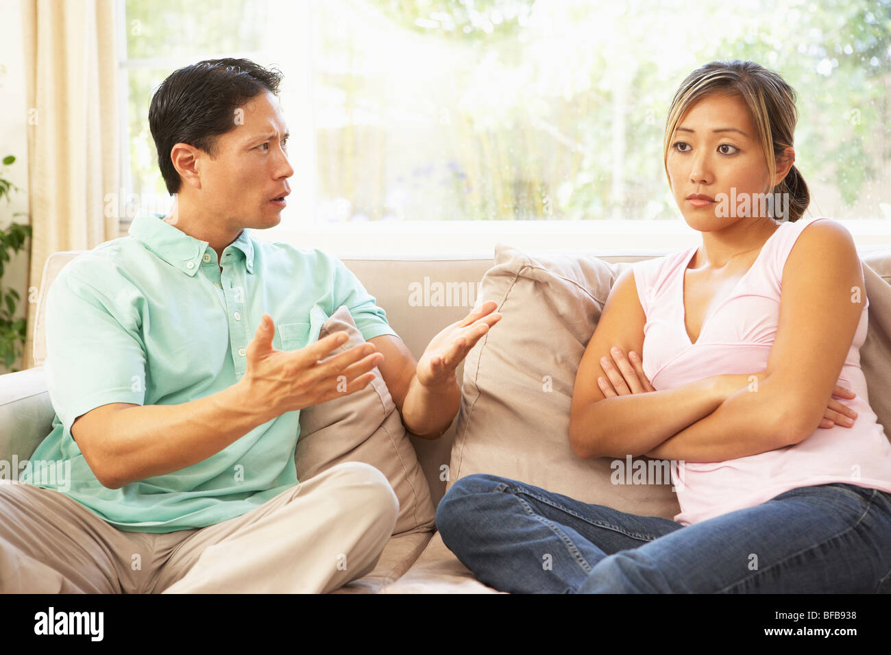 Young Couple Having Argument At Home Stock Photo