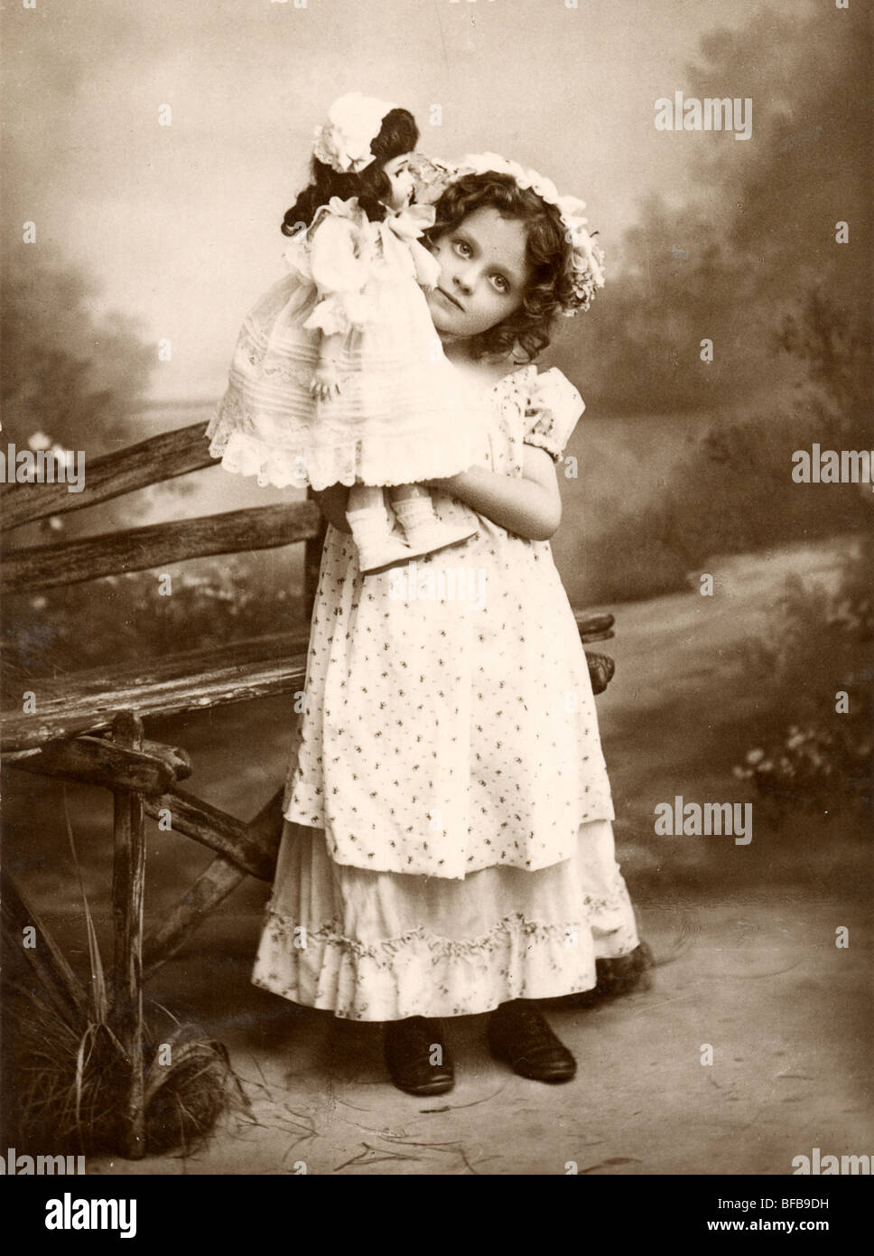 Little Girl Proudly Displaying Her Large Doll Stock Photo