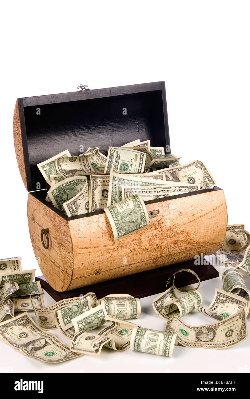 A cash box full of spilling money is good for economic, savings, financial and savings inferences. Stock Photo