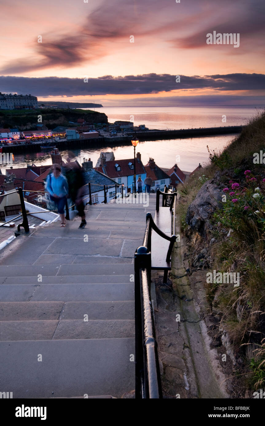 People going up the steps leading to St Mary's Church from Old Town of Whitby, North Yorkshire Stock Photo