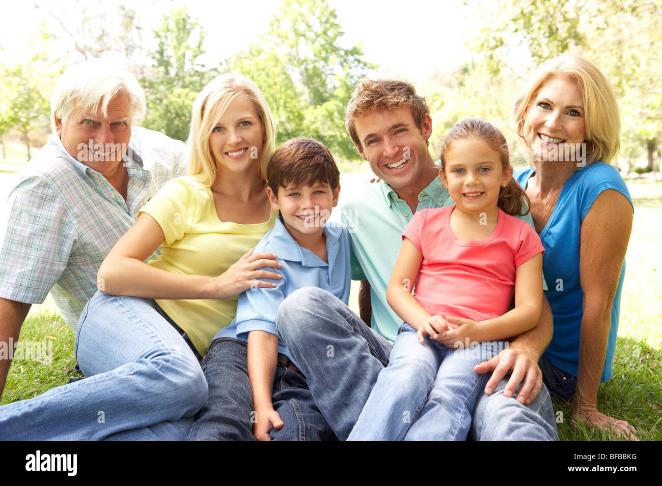 Extended Group Portrait Of Family Enjoying Day In Park Stock Photo