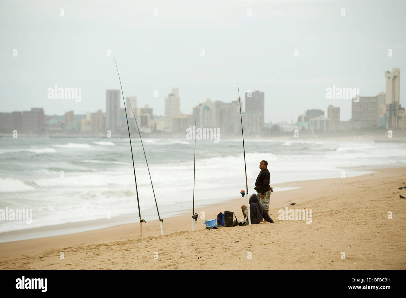 Fisherman on the Durban beach front. South Africa Stock Photo