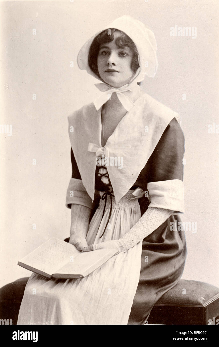 Beautiful Quaker or Puritan Girl Reading a Book Stock Photo Alamy