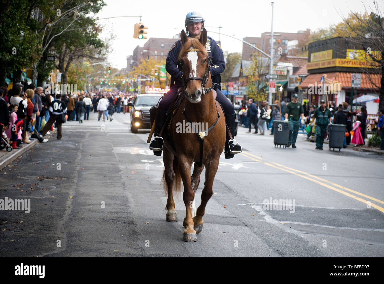 A mounted NYPD officer marches in the 20th Annual Jackson Heights