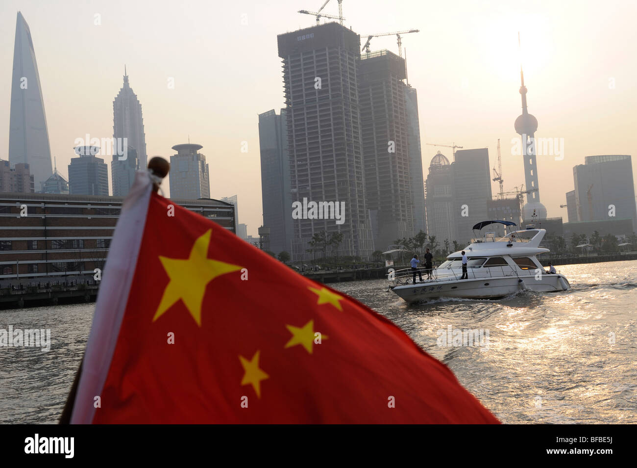 Chinese national flag over Huangpu river and Pudong commercial district, Shanghai, China. 29-Oct-2009 Stock Photo