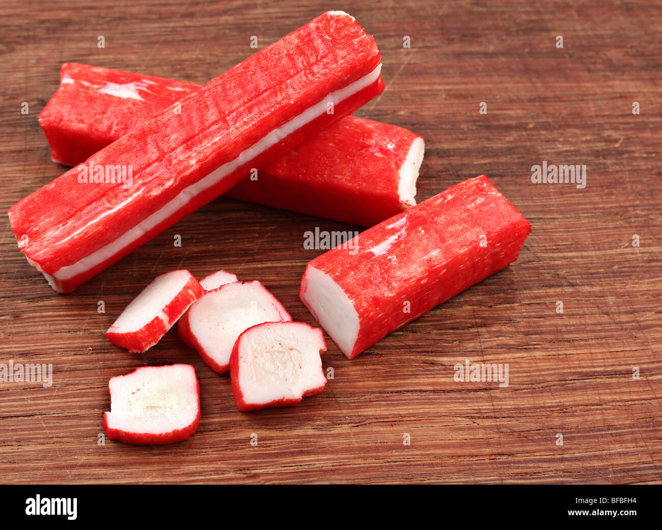 Surimmi Surimi crab stick closeup on wood board Stock Photo - Alamy