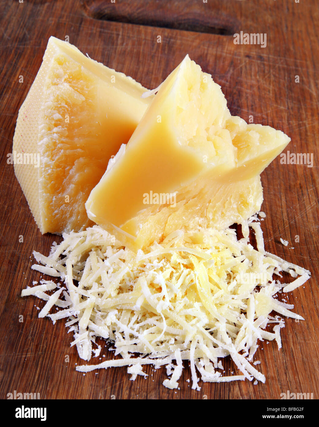 Dairy product parmesan cheese grated on board Stock Photo Alamy