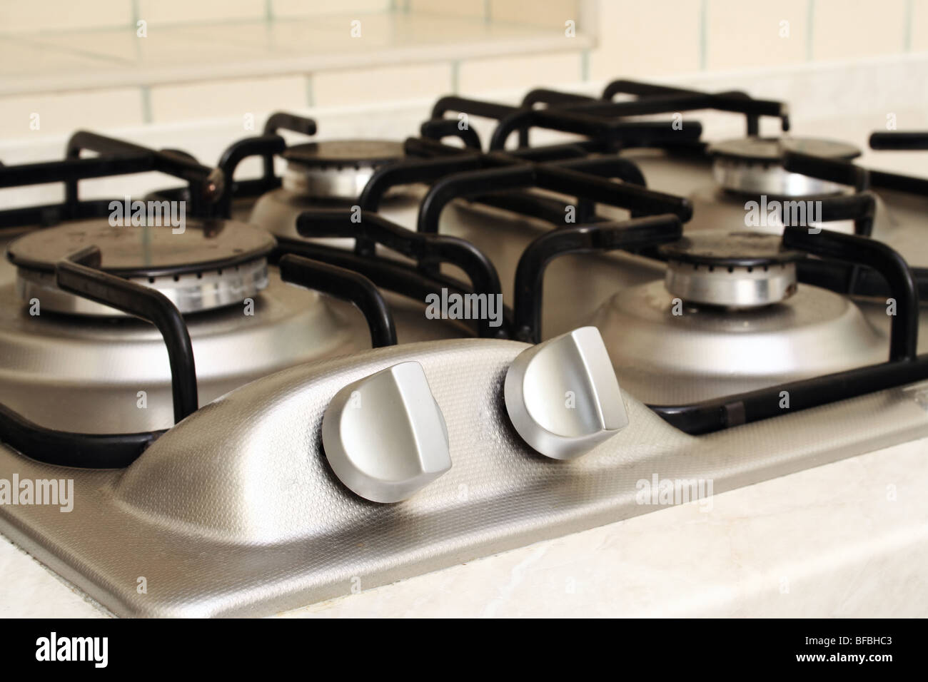 Element management on metal stove in kitchen Stock Photo