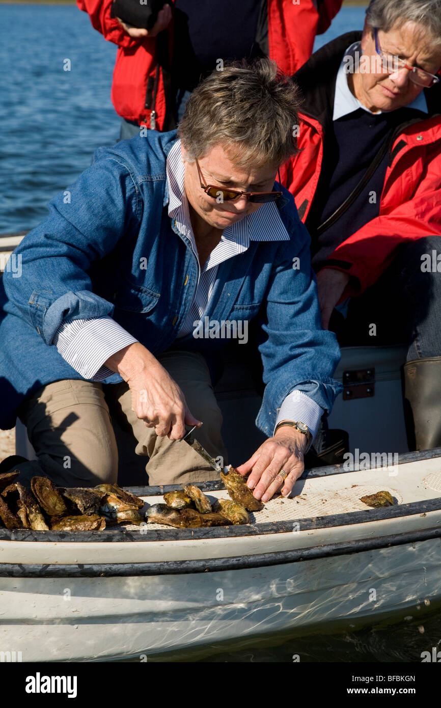 Tourists learn to shuck oysters, Salutation Cove, Prince Edward Island
