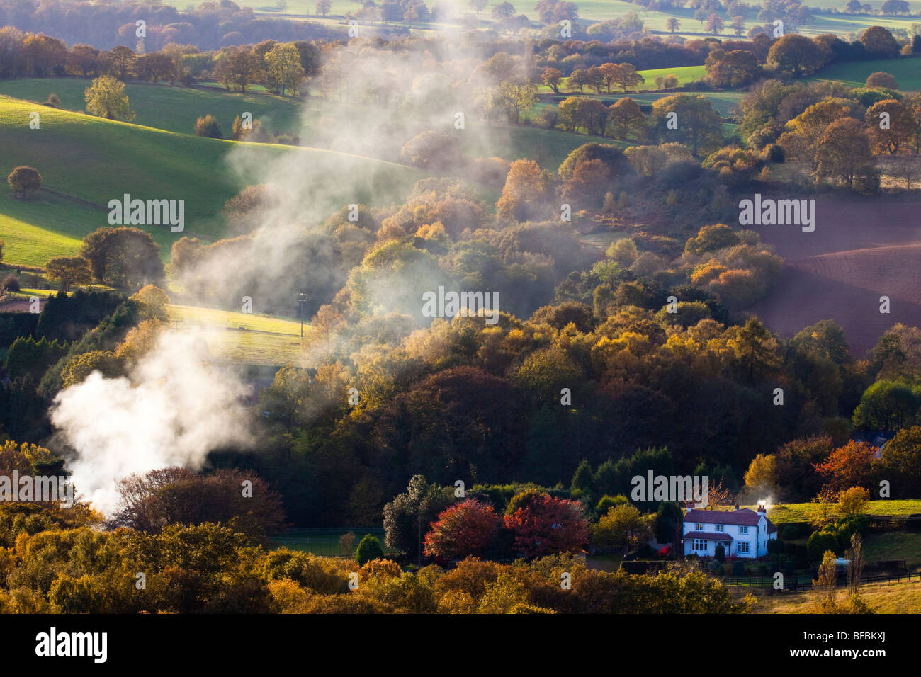 England, Staffordshire / Worcestershire. Smoke from burning in the countryside near Kinver - Viewed from Kinver Edge Stock Photo