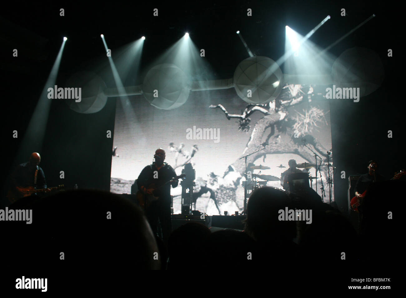 The Pixies play a concert at the Hollywood Palladium, Doolittle tour, with black and white film projected behind them Stock Photo