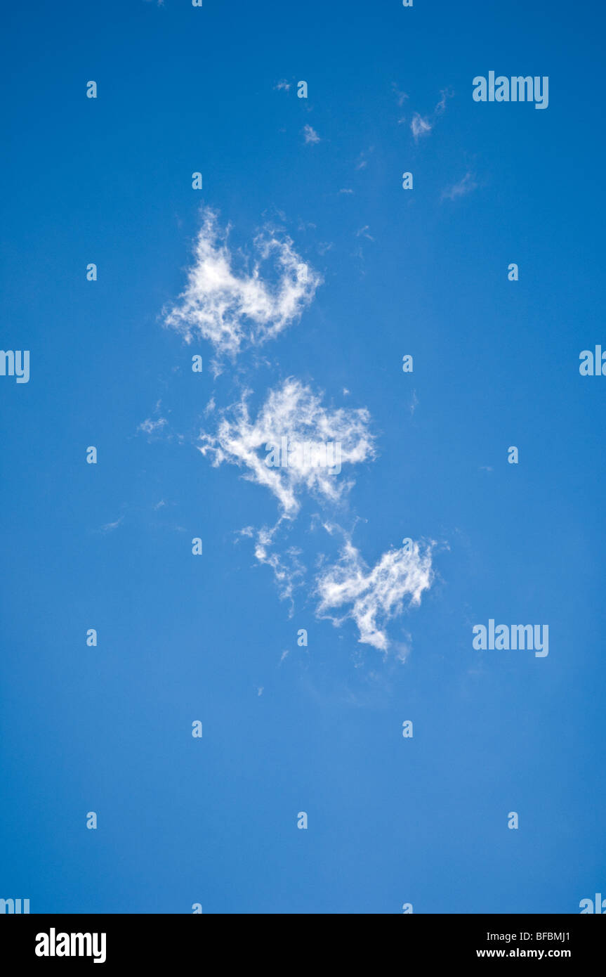 Three Puffy White Clouds in a Blue Sky Stock Photo - Alamy