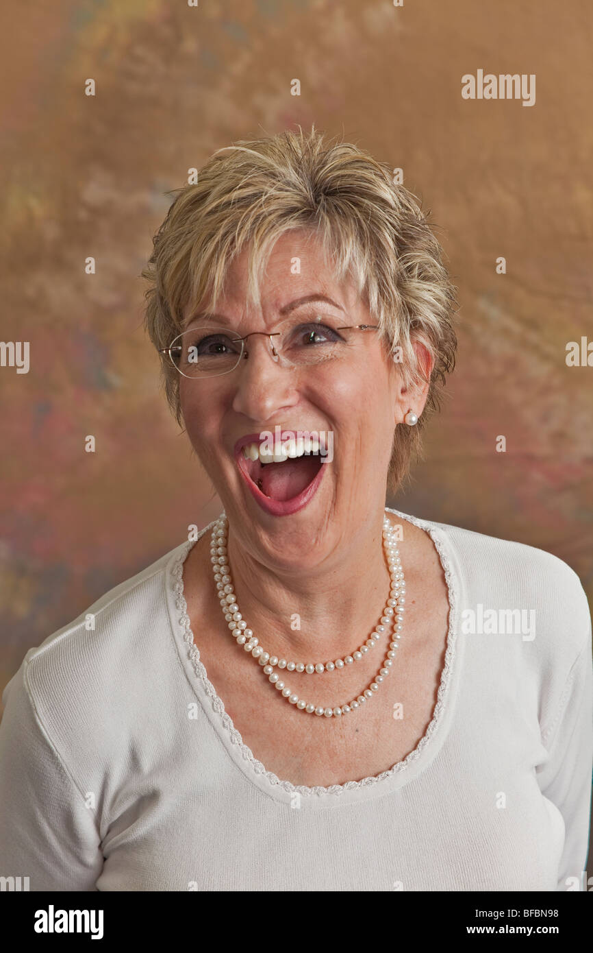 Happy Laughing mature woman 50-60 year years old. MR Stock Photo