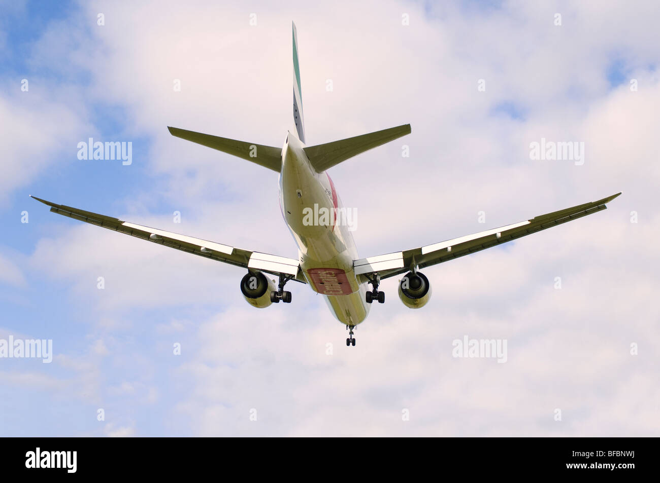Boeing 777 operated by Emirates on approach for landing at Birmingham Airport Stock Photo