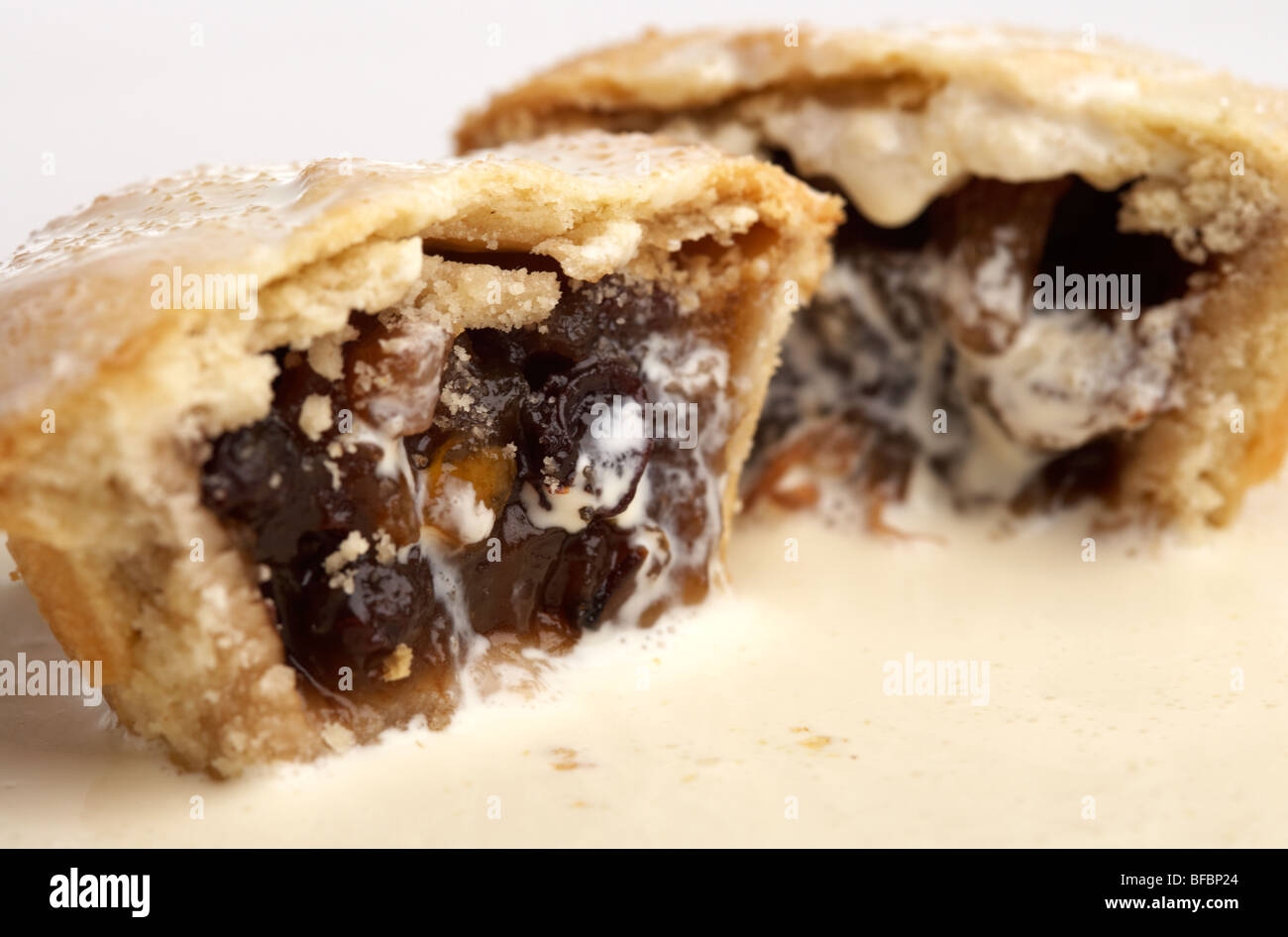 mince pies sliced covered in fresh cream Stock Photo
