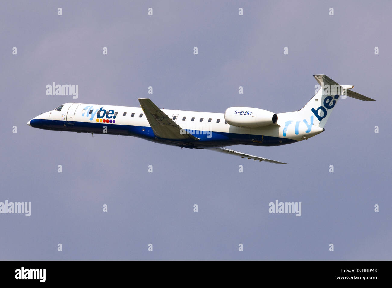 Embraer ERJ-145 operated by Flybe climbing out from take off at Birmingham Airport Stock Photo