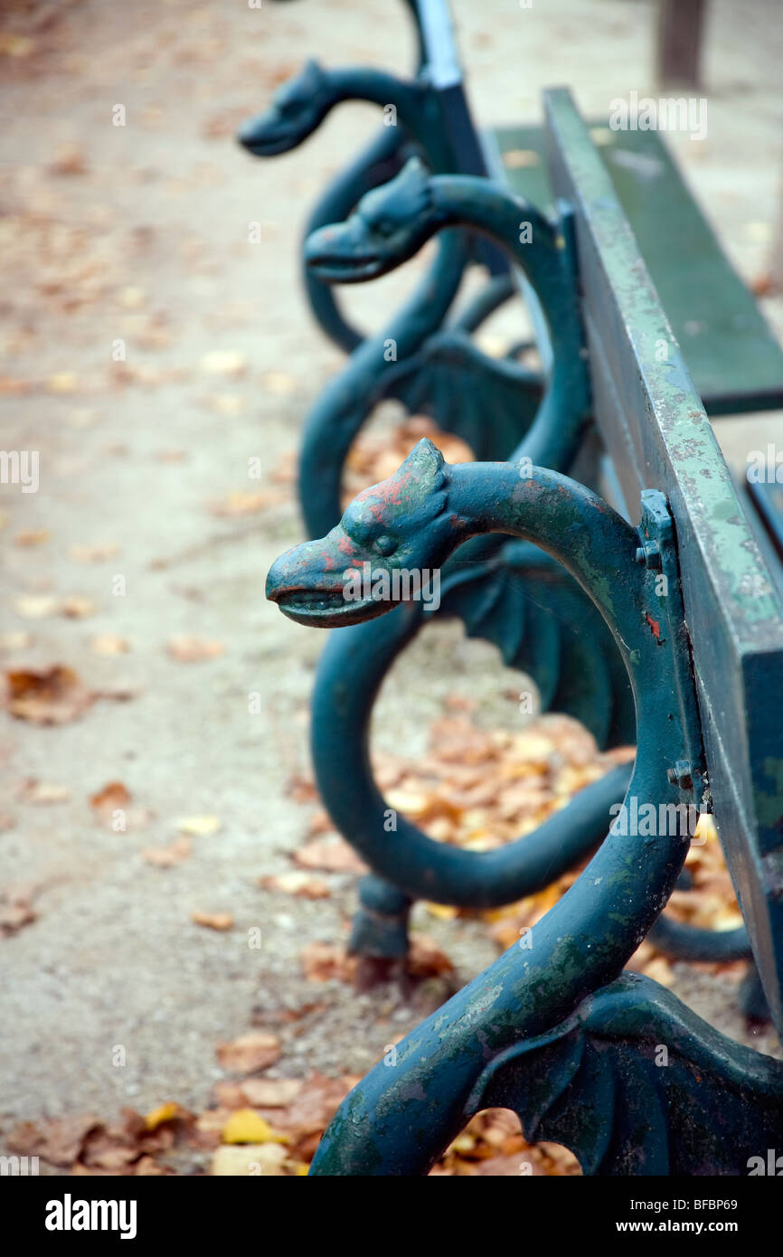Heads of serpents decorating a park bench, Bruges Belgium Stock Photo