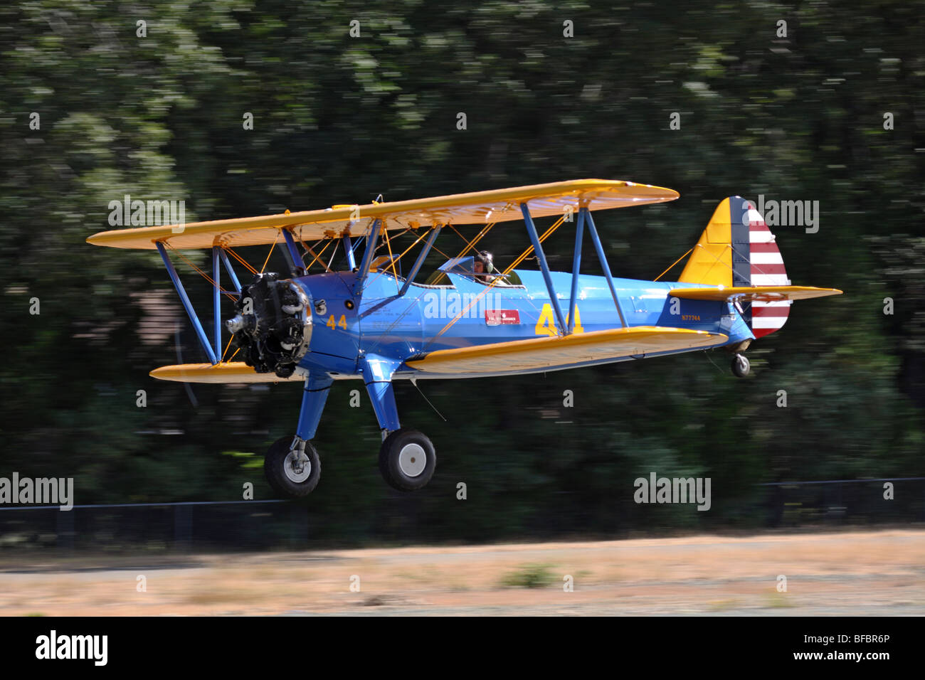 Boeing PT-17 Stearman in flight over the Nevada County Airport in Grass Valley, California. Stock Photo
