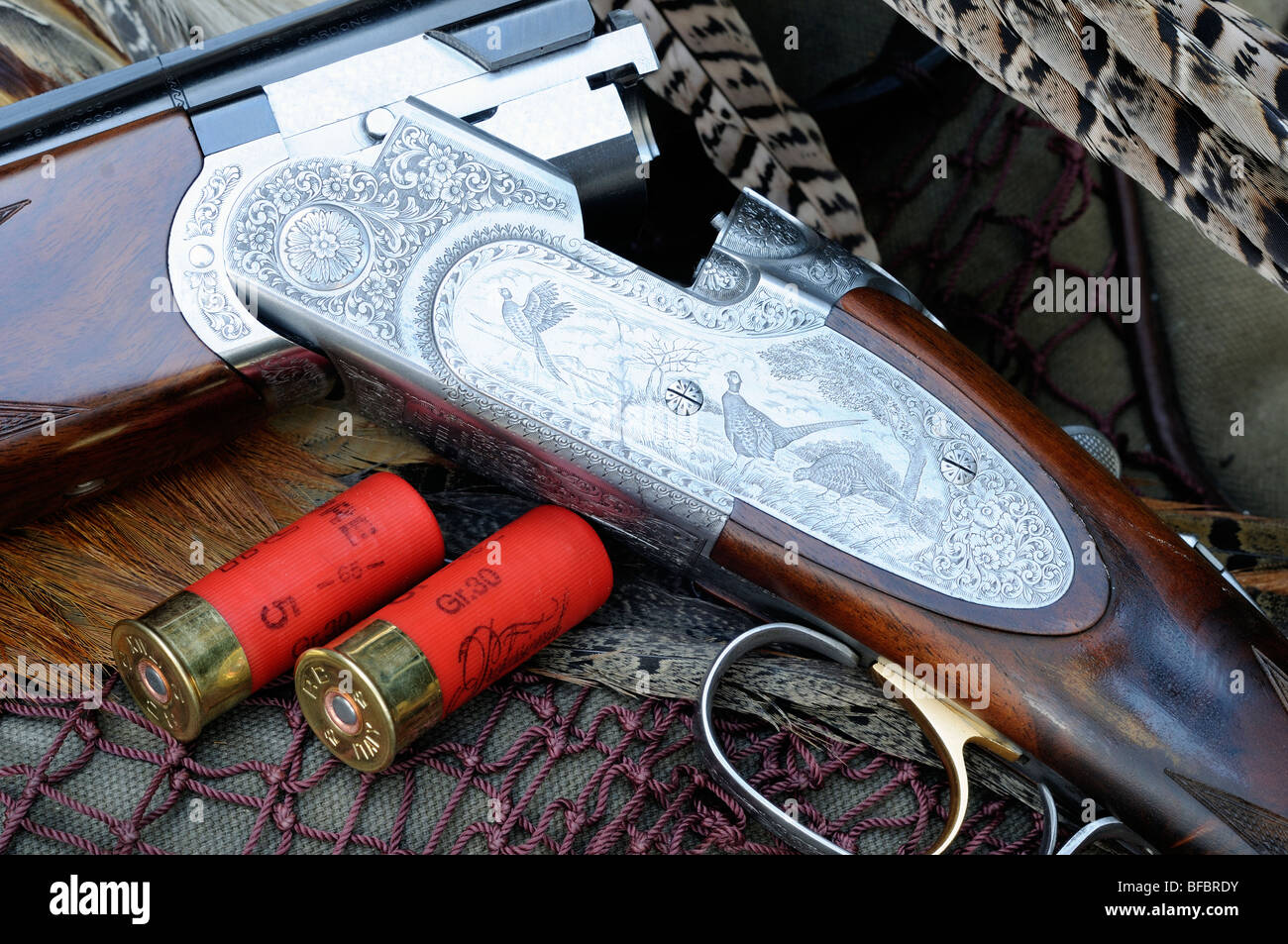 Finely engraved side plate of 12 bore over and under shotgun with two ...